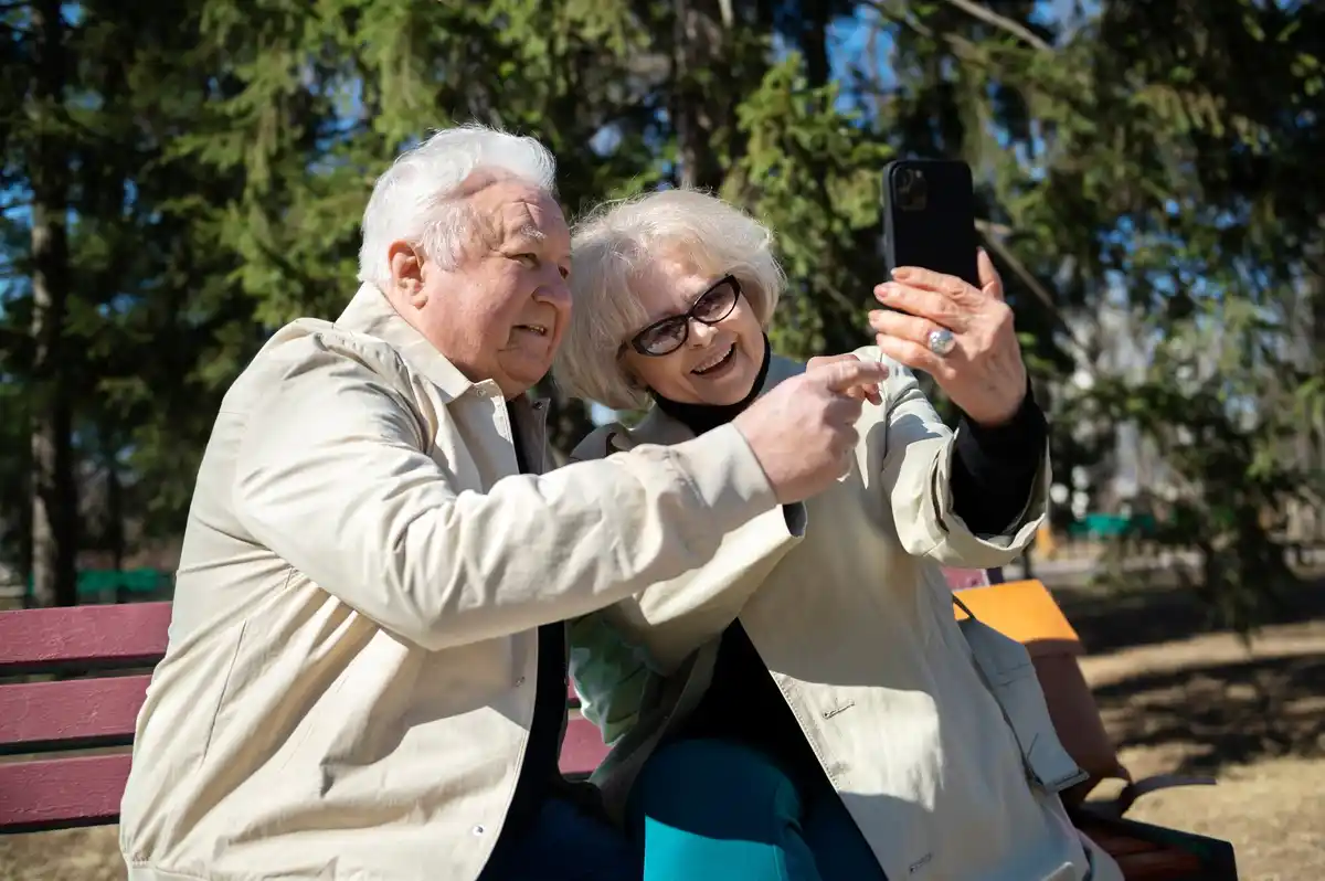 happy elderly japanese people outdoor community