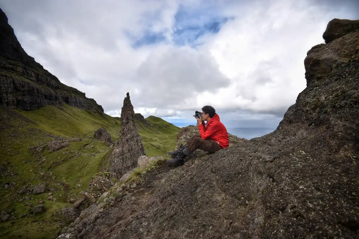 tourist near volcanic fumaroles with gas mask