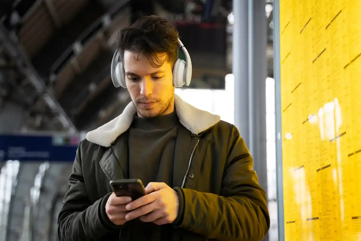dutch person bored looking at empty hands, no phone, urban life