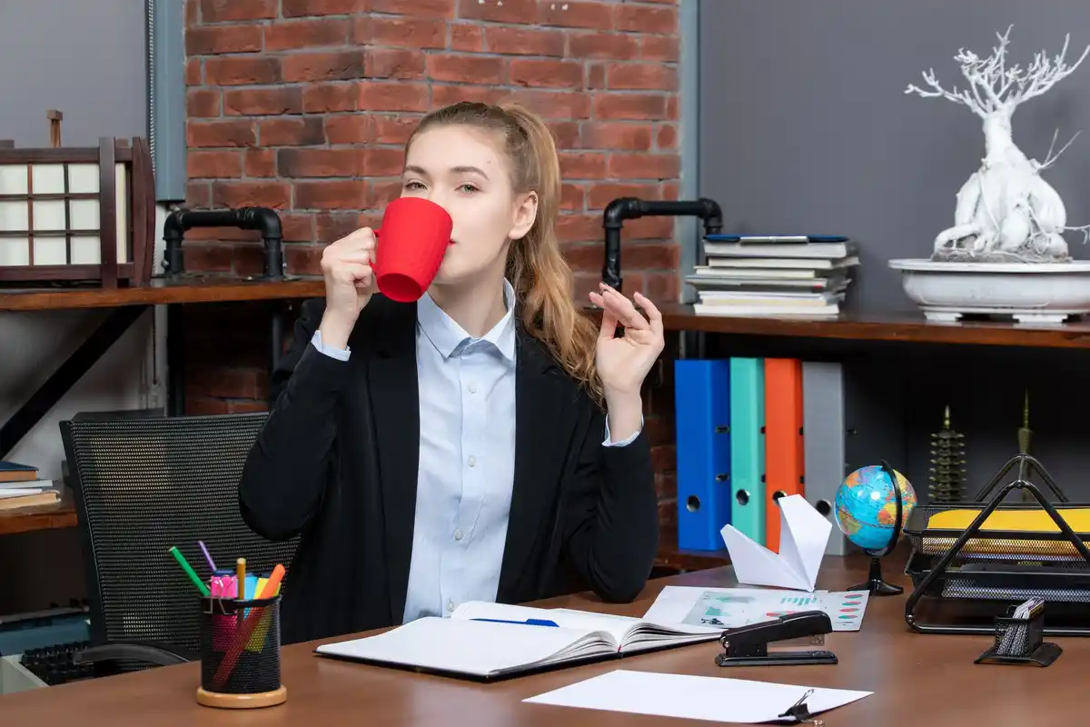 overwhelmed dutch office worker notepad pen coffee mug