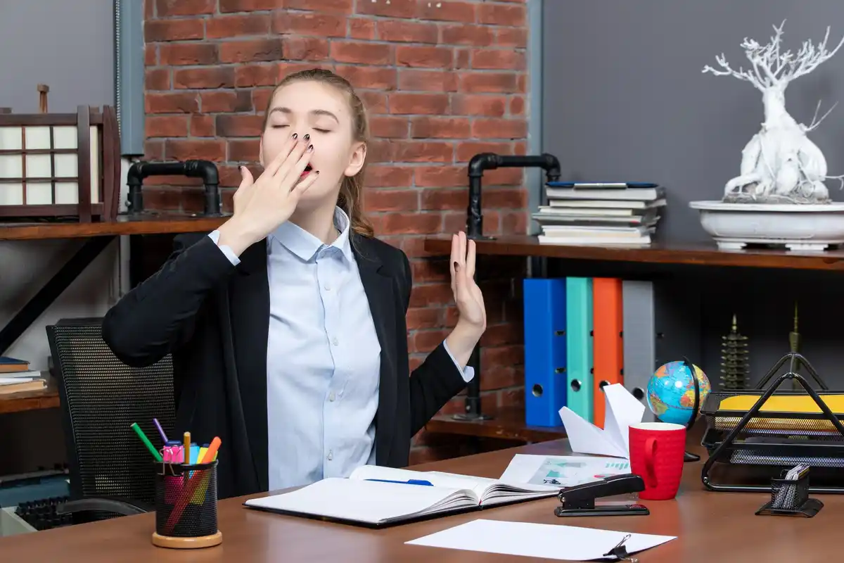 yawning person in office context, Dutch people