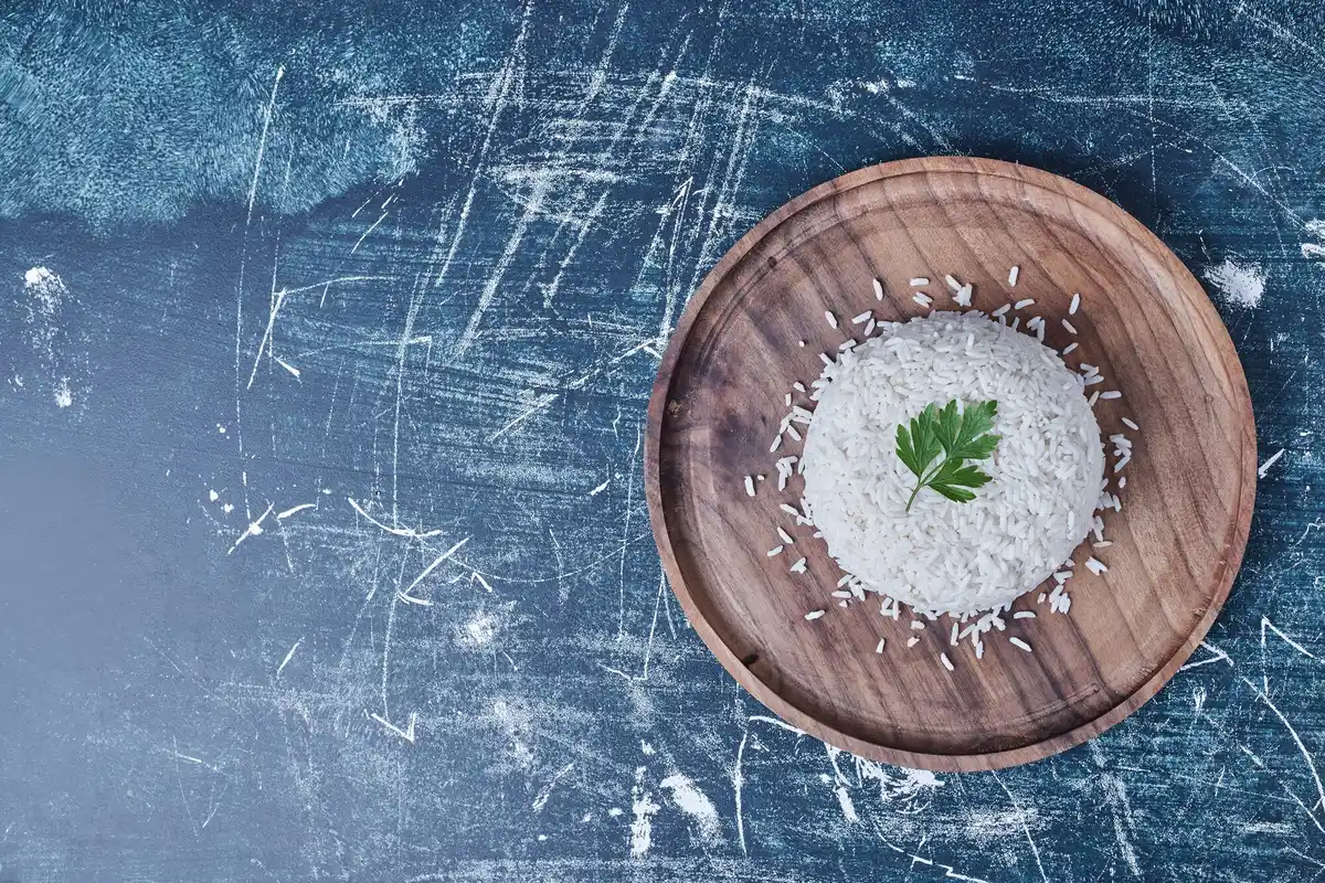 wet phone in bowl of rice top view