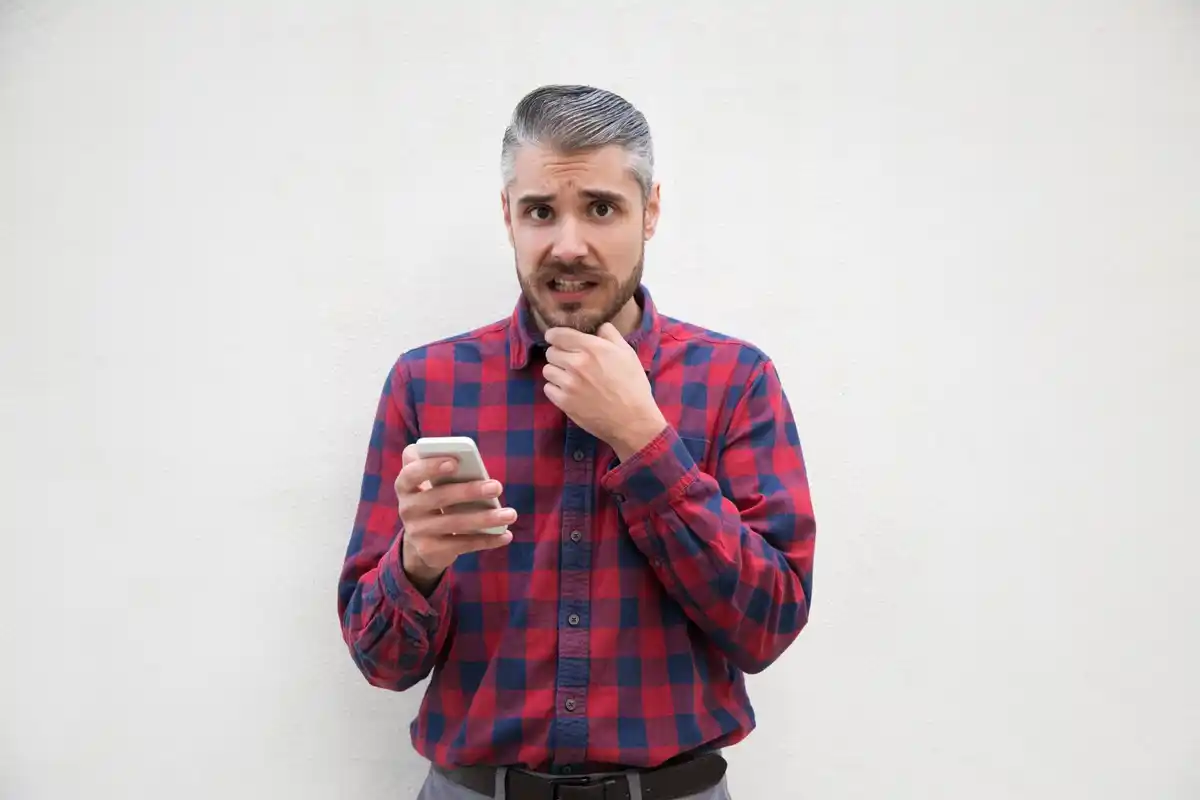 close up of a forgetful dutch adult with smartphone