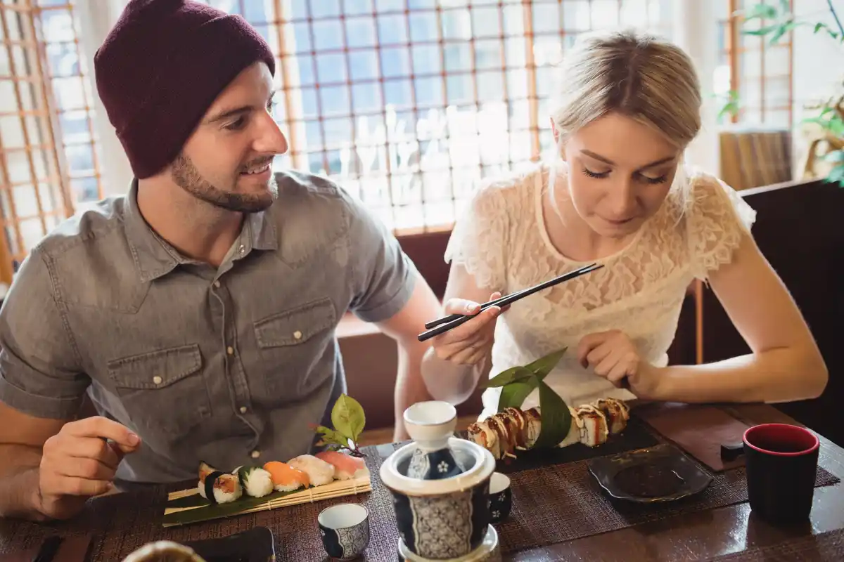 Chinese couple sharing tea in traditional home