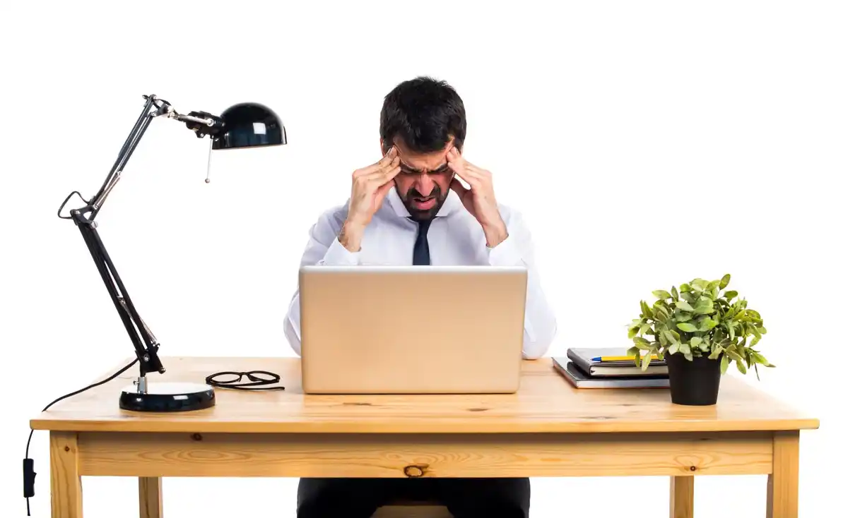 tired office worker at desk burnout prevention