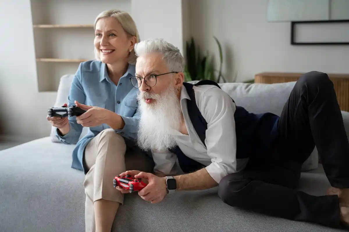 grandfather playing video games with grandson living room