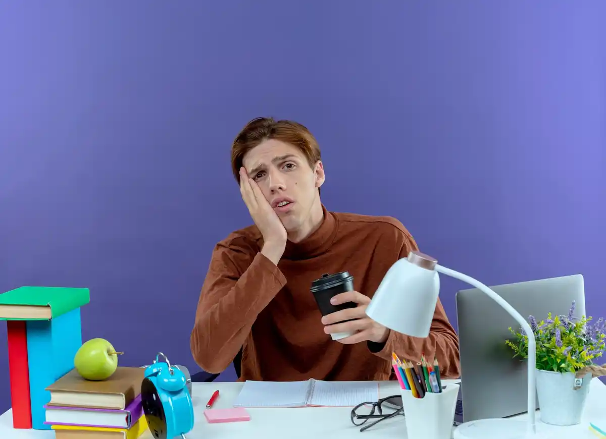 dutch person looking stressed at smartphone in home office