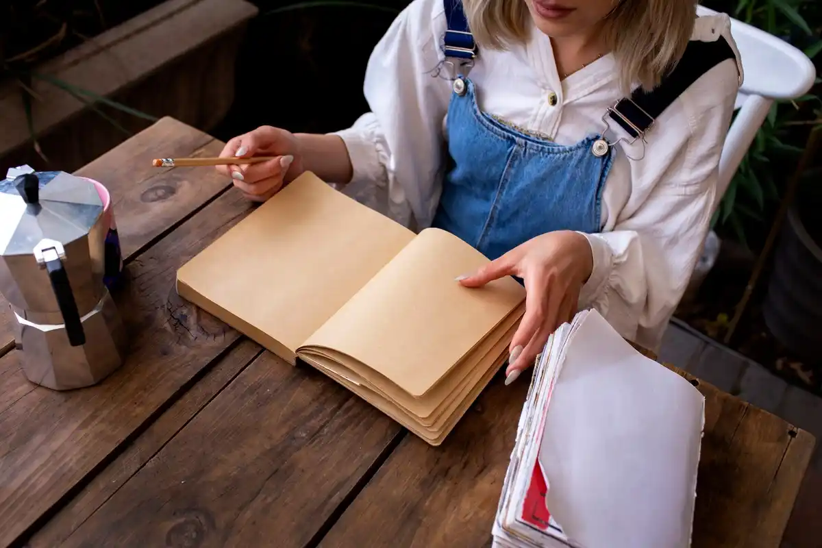 archaeologist fieldwork paper notebook muddy hands