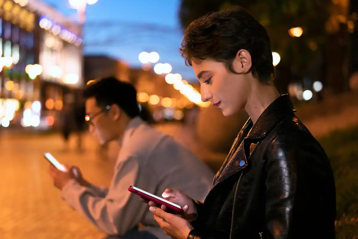 Dutch person using stargazing app on smartphone under night sky