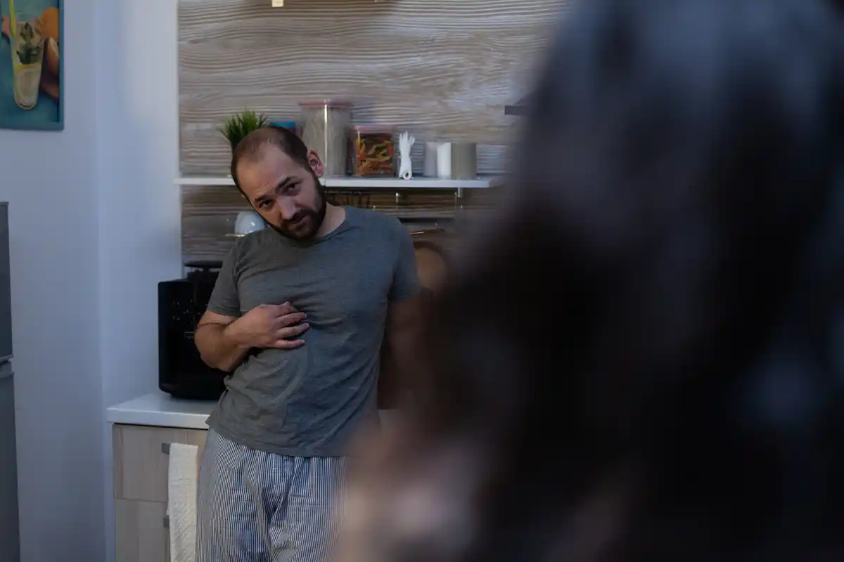 dutch man checking his pulse in the morning home