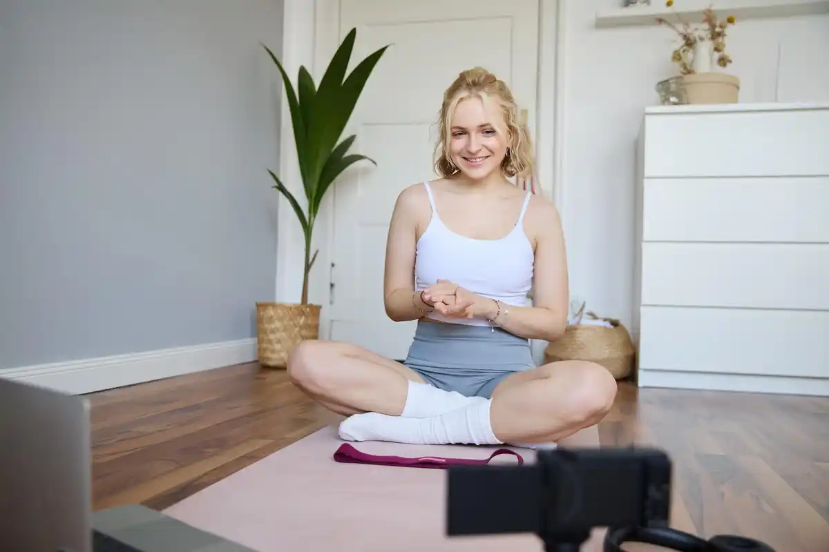 fit dutch woman doing breathing exercises at home morning