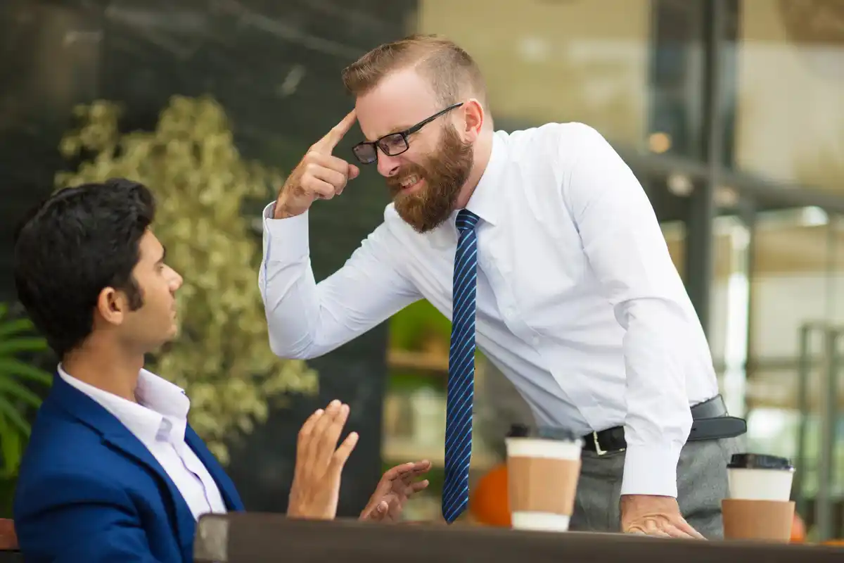 uncomfortable business meeting facial expressions international