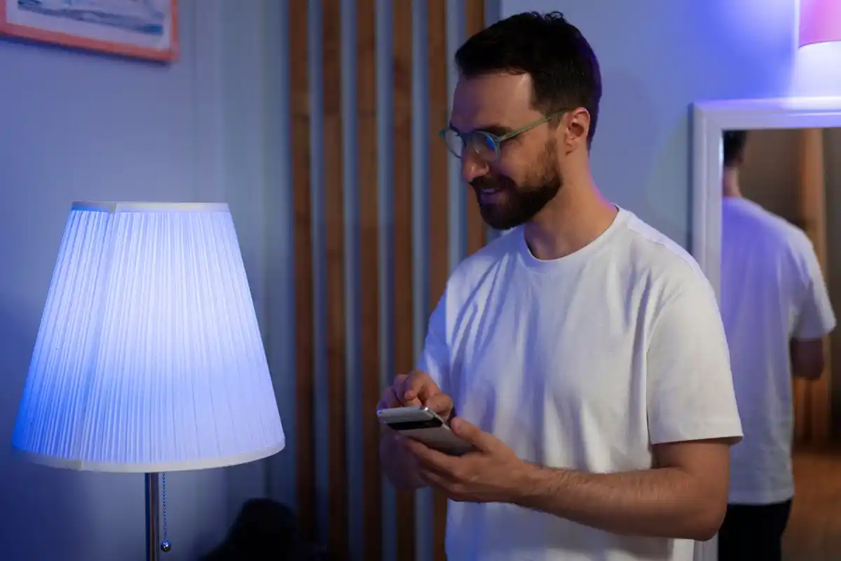 man resetting internet router modern home technology