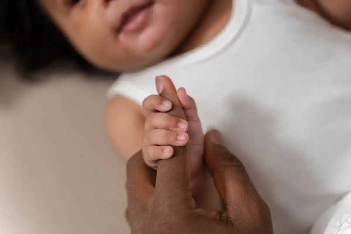 baby gripping adult finger incredibly strong reflex