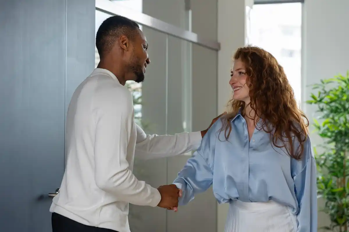 handshake awkward multicultural workplace