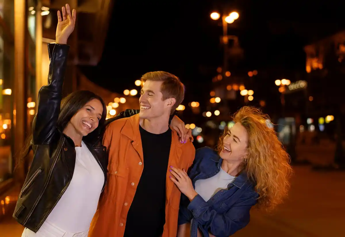 dutch family looking at smartphone sky app night