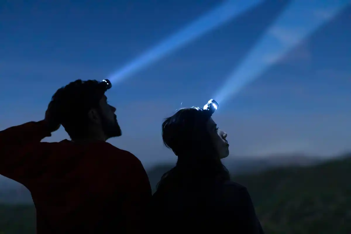 elderly and young stargazing together Netherlands night sky