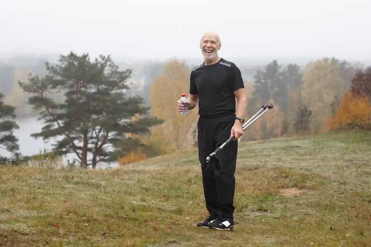 elderly man metal detecting dutch countryside