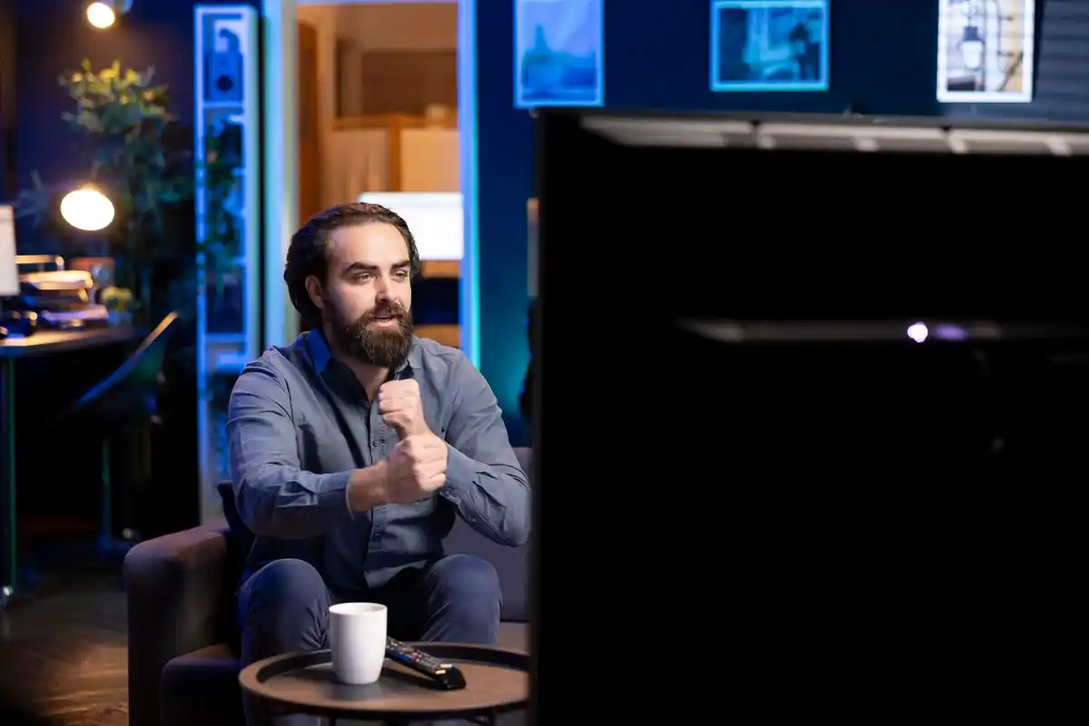 man covering smart tv camera microphone living room privacy