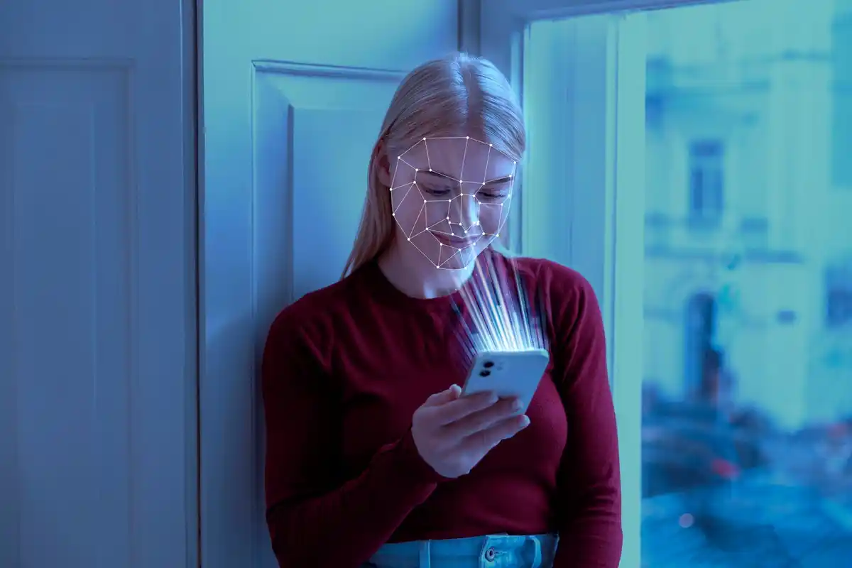 dutch office people using biometric authentication on smartphone