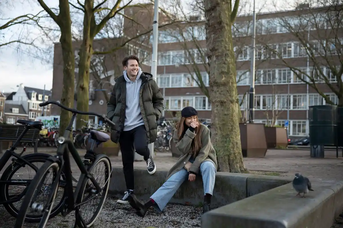 busy dutch city street person pausing for mindfulness