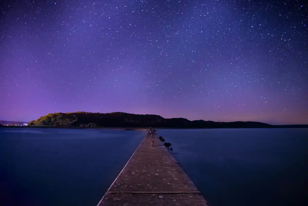 twinkling stars in the night sky over netherlands countryside