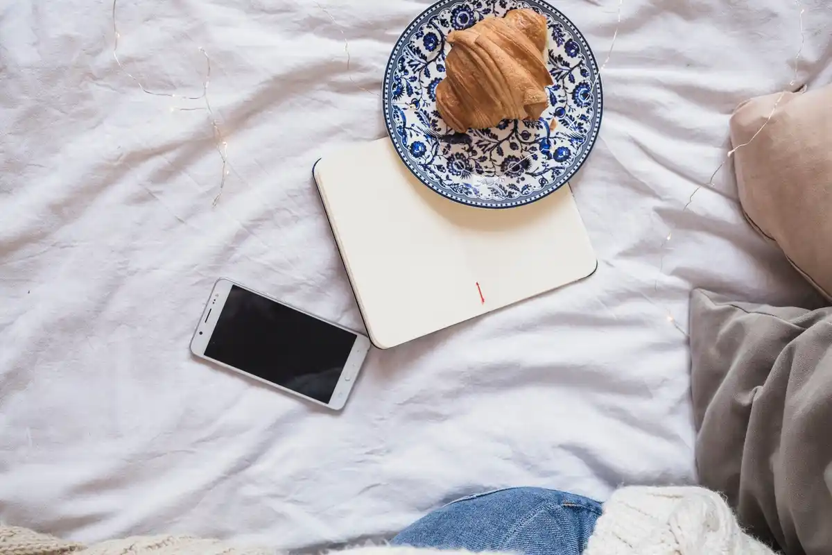 nightstand with turned off phone in Dutch bedroom