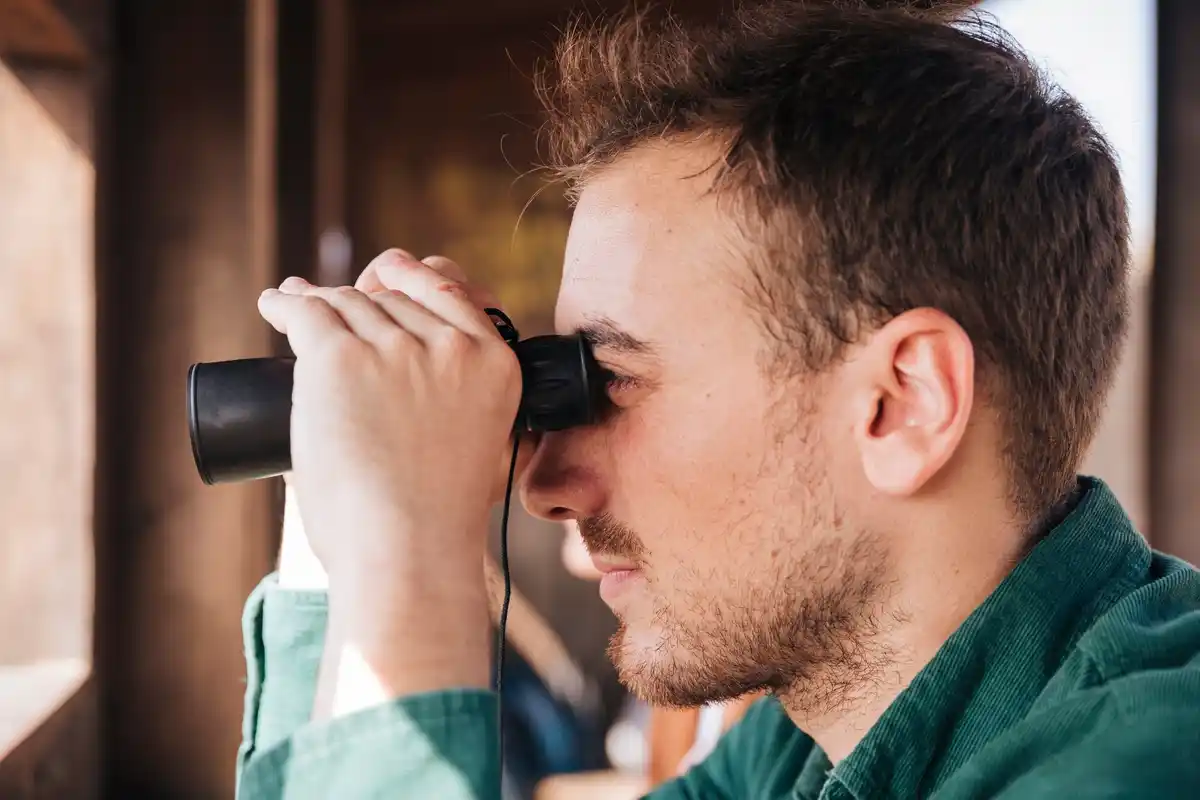 amateur astronomer looking at Jupiter through telescope Netherlands