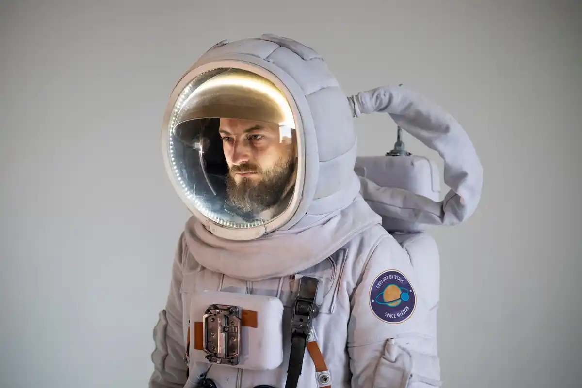older astronaut in space, ISS, senior in spacesuit, ageing in zero gravity