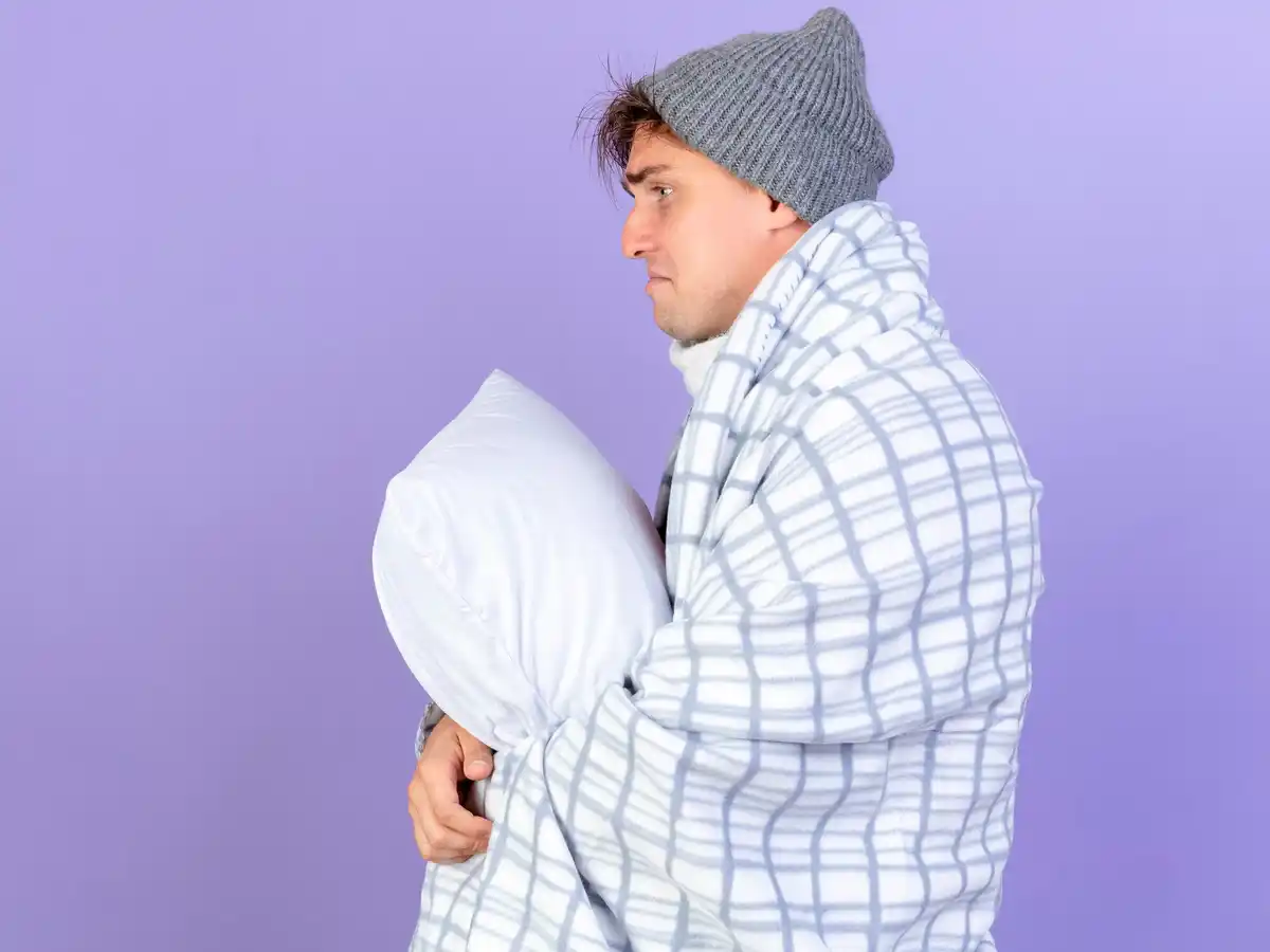 person turning pillow in bright bedroom full moon