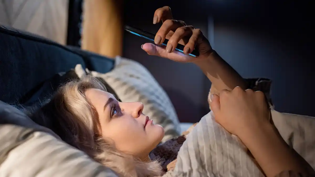 phone next to bed at night Dutch bedroom