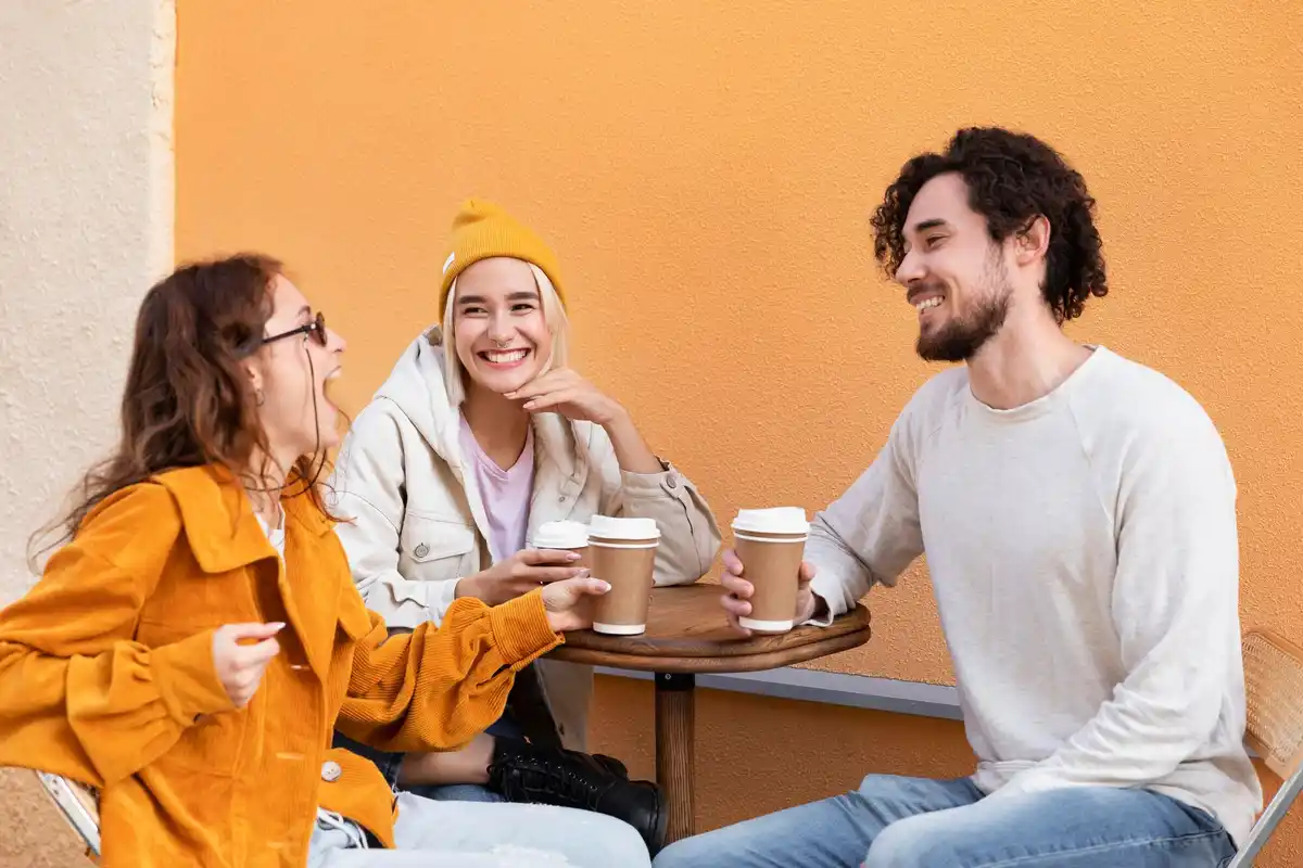 Dutch friends laughing at cafe terrace