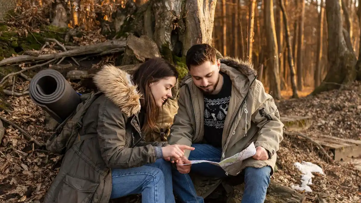 dutch youth using paper map outdoors