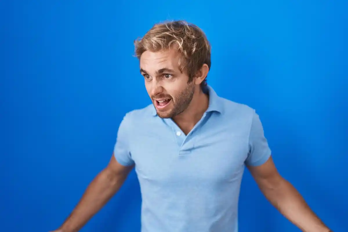 Dutch men holding back tears in public, subtle expression