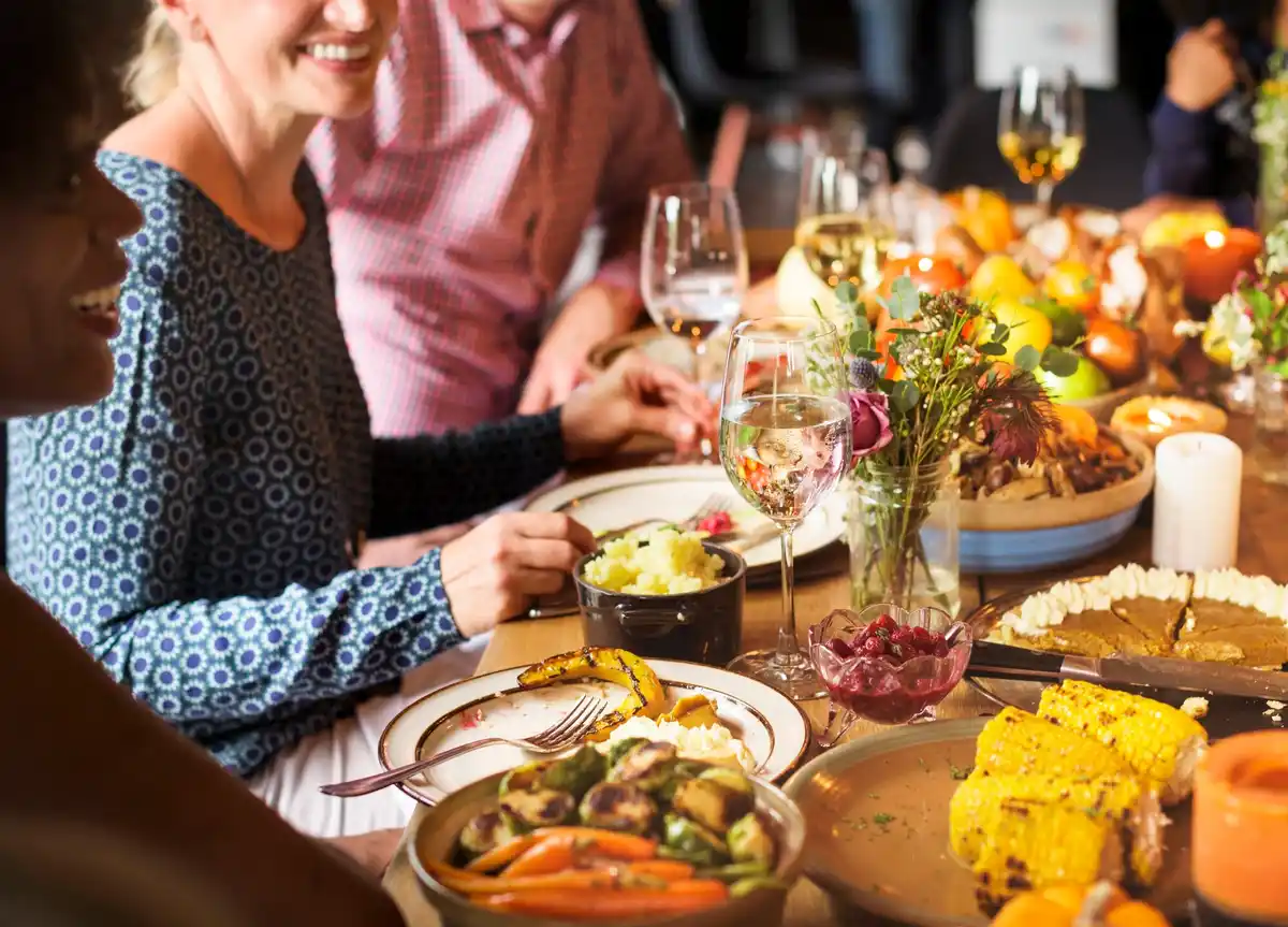 vintage Dutch dinner table with healthy traditional food and people over 50