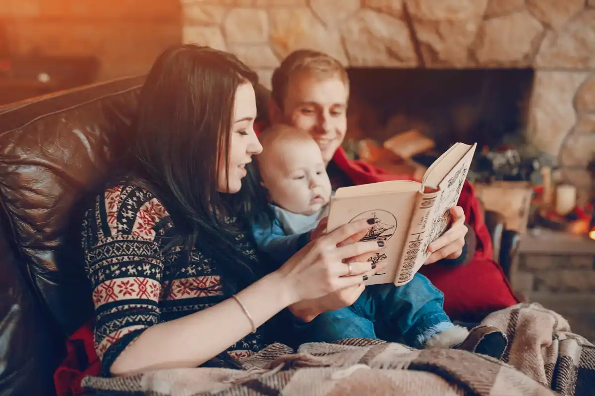 amused family reading space books children laughing