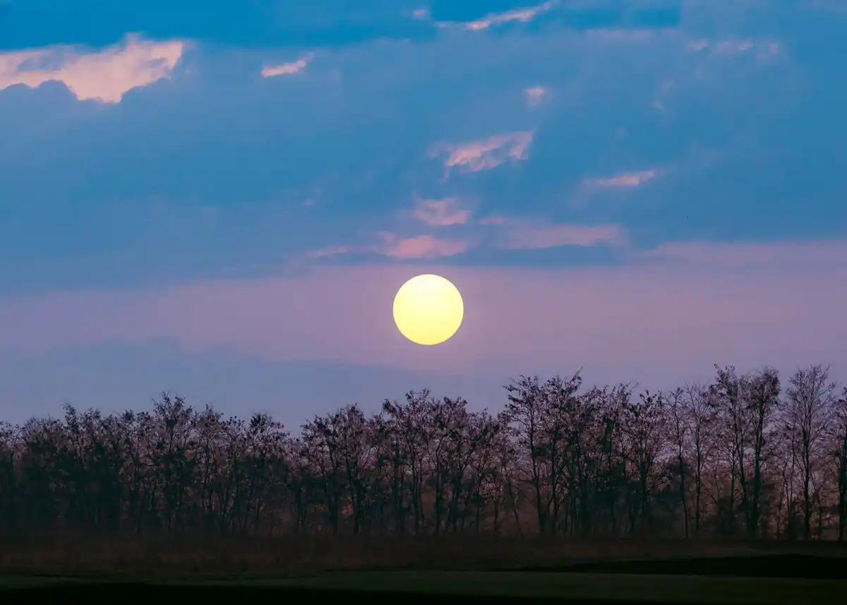 full moon above Dutch city skyline