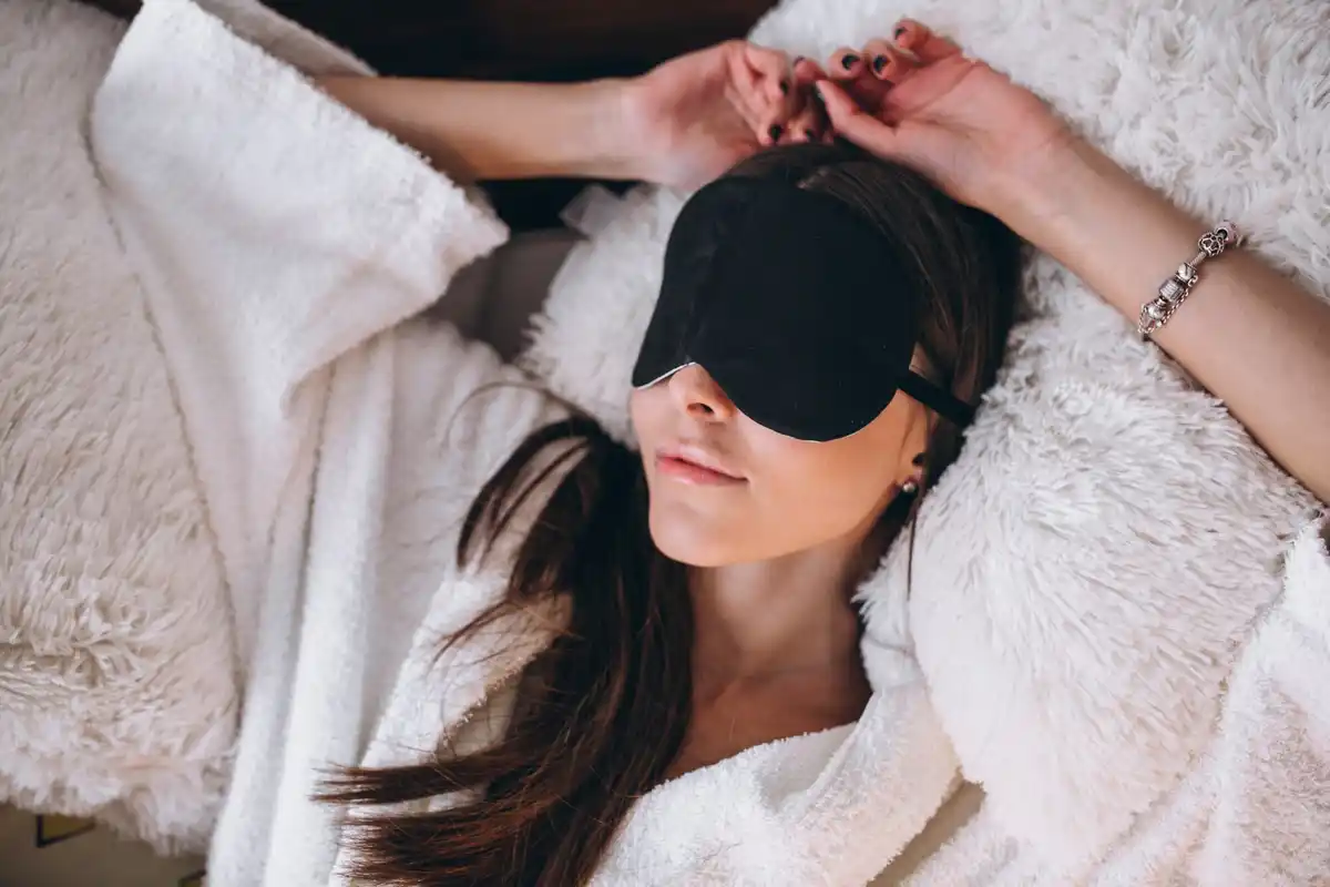 person wearing sleep mask under bright moonlight