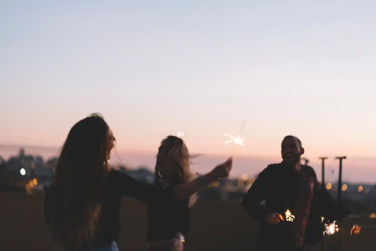 group of friends watching night sky with mobile phones and astronomy app