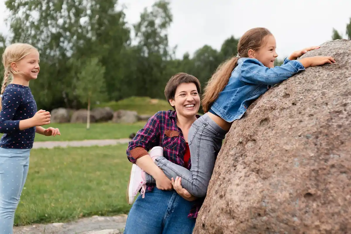 Dutch people trying to build a stone pyramid in park, teamwork fail