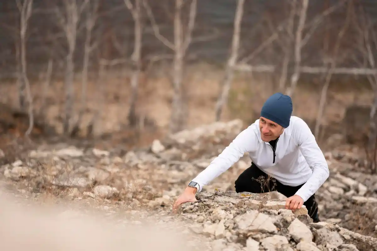 Dutch geologist investigating soil cracks