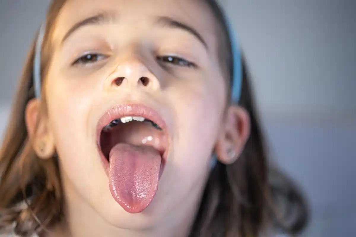 close up droplet of saliva on tongue