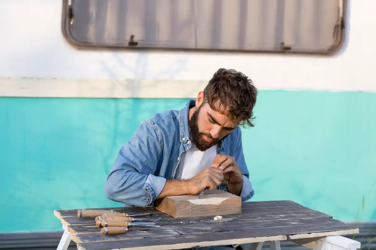 real Dutch archaeologist cleaning historical artifact with hands on table