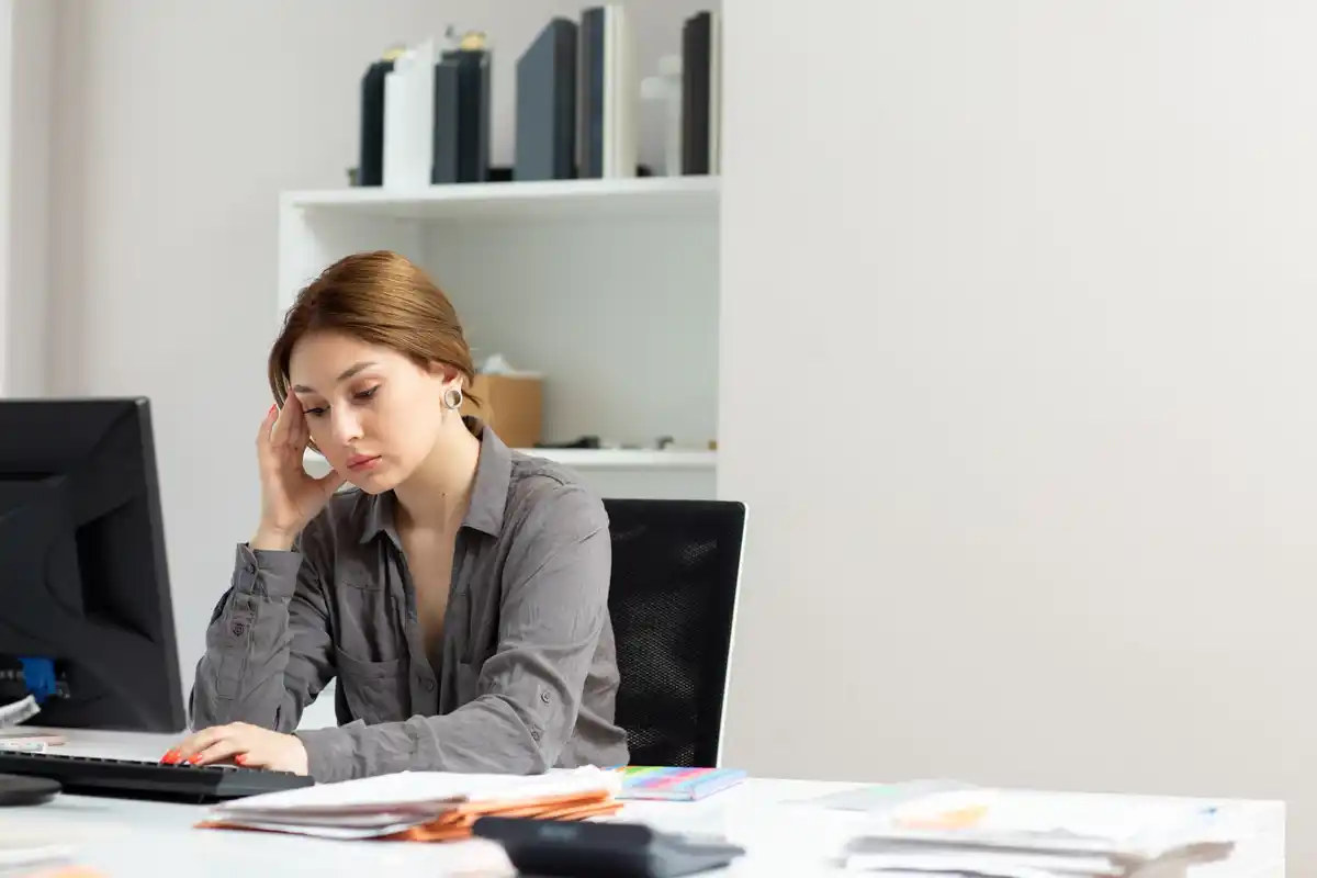Dutch office worker stress headache woman