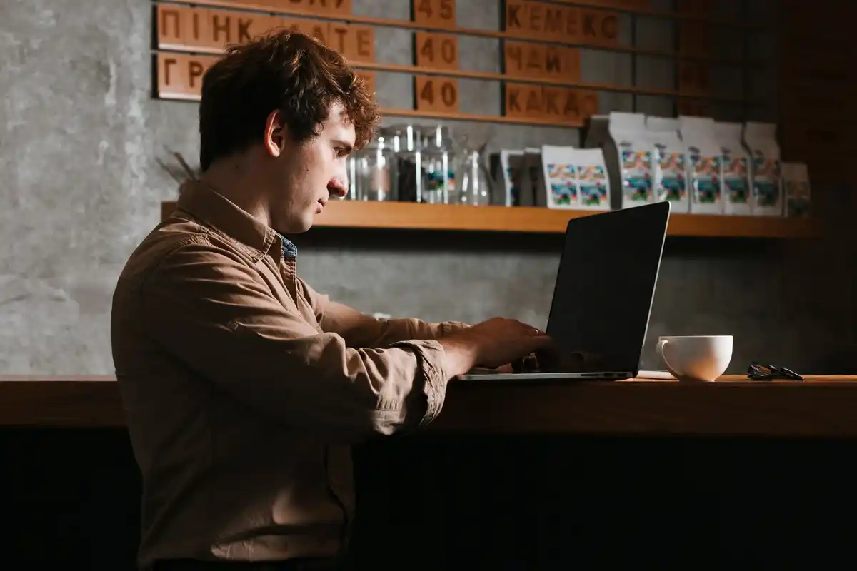 late night coder taking a break, closed laptop, city lights