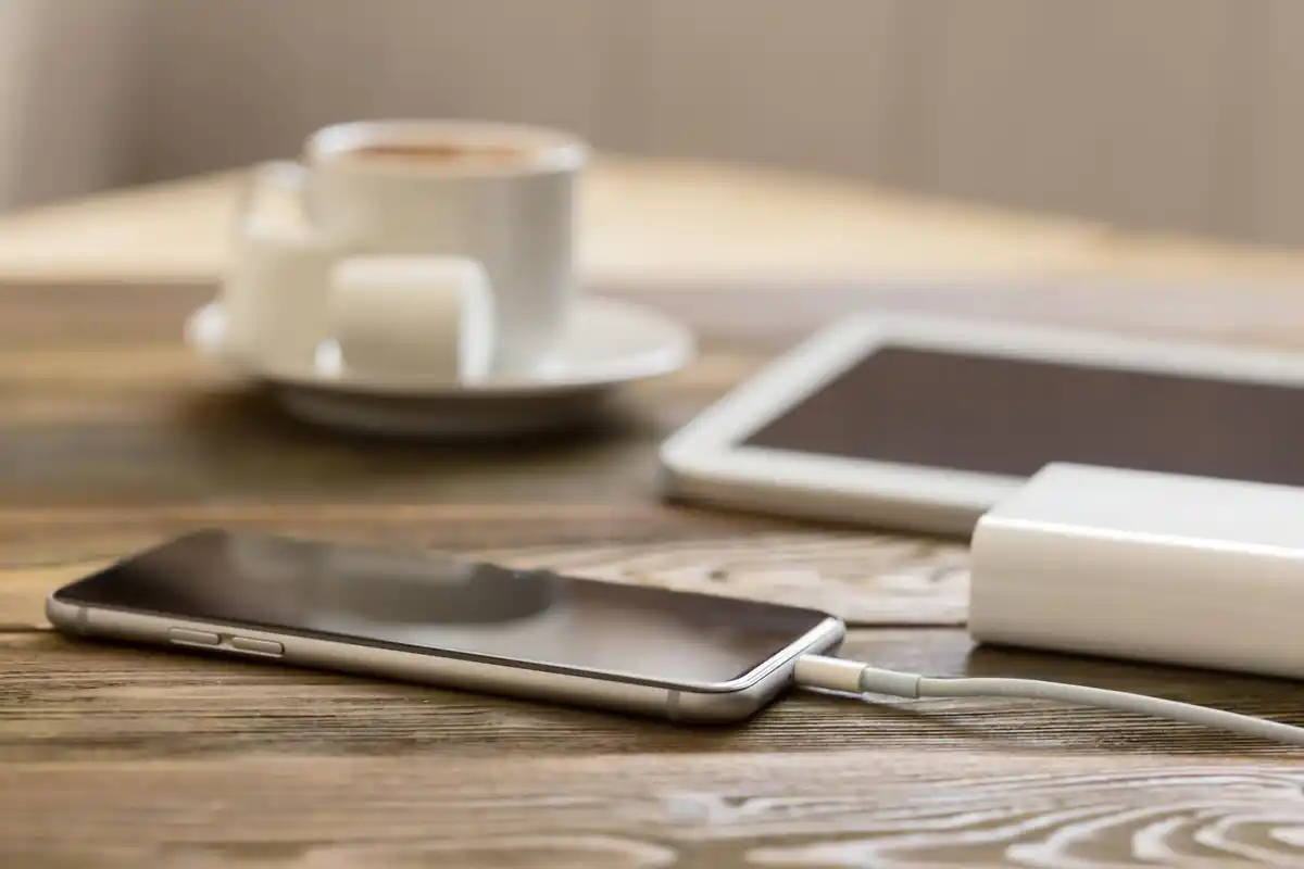 smartphone charging on nightstand close up dutch home setting