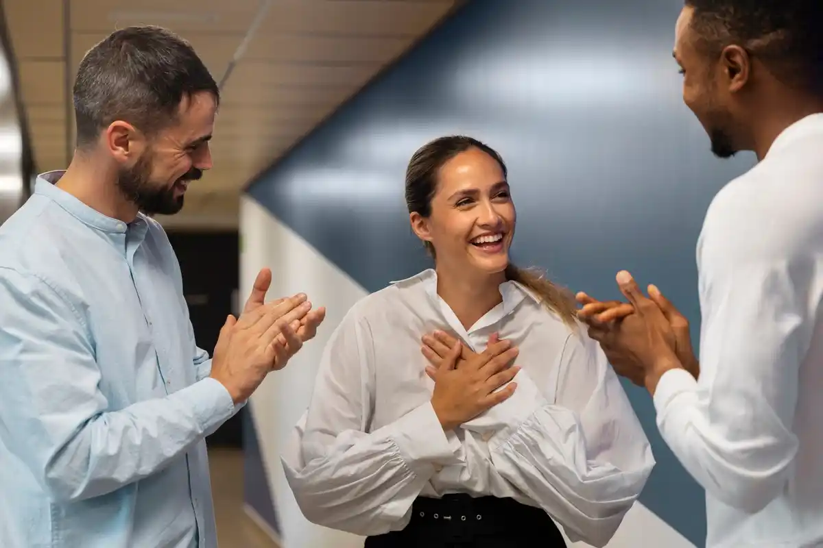 Indian and Dutch people greeting in an office setting