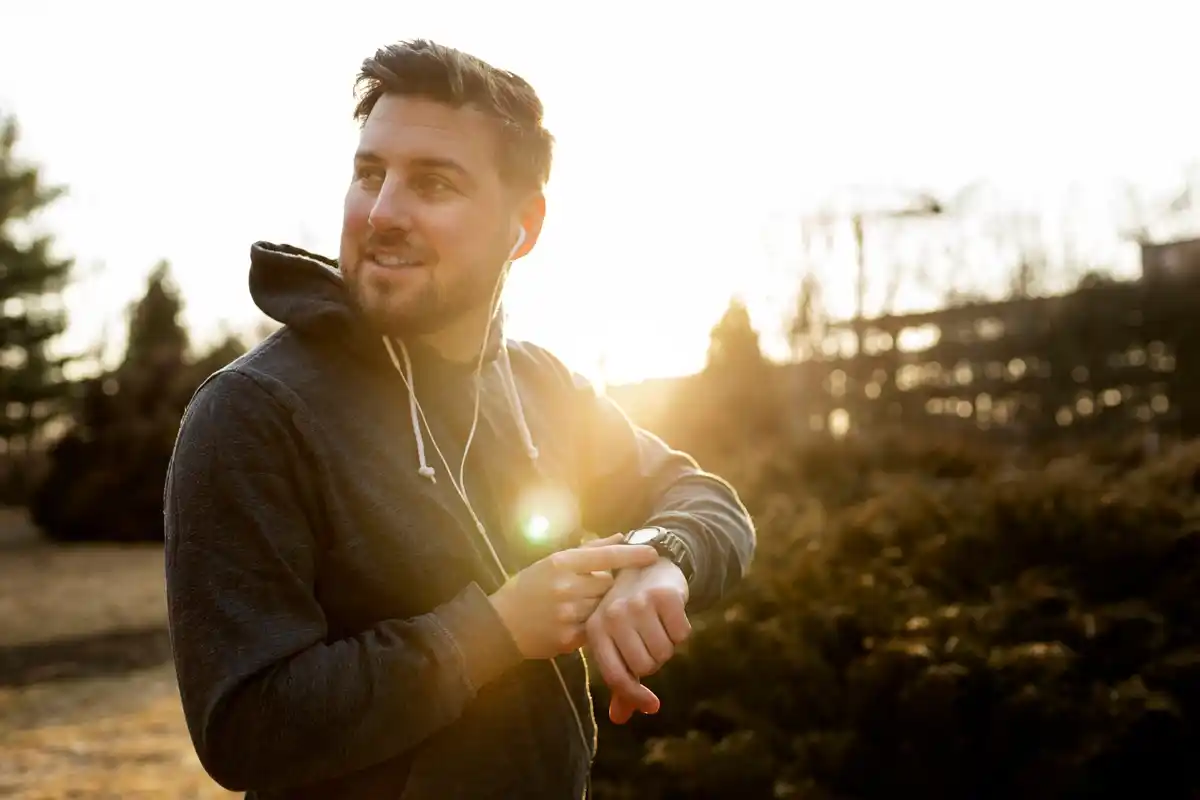 dutch person checking heart rate on smartwatch urban