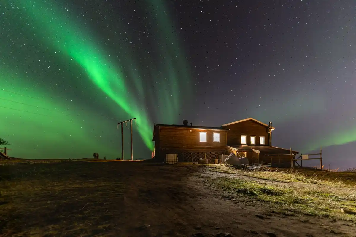 night sky above Dutch village with shooting star